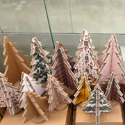 The cardboard Christmas trees by Lessmore are made of recyclable paper and cardboard in various colors and finishes, the result of the sustainable design experience of the Caporaso studio